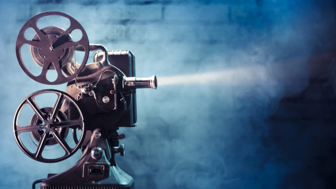 old film projector with dramatic lighting
