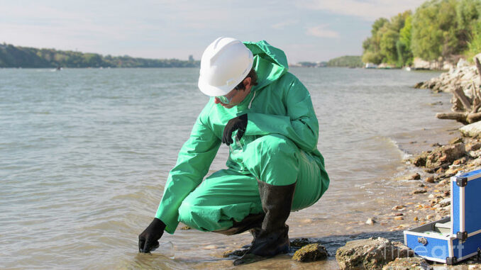 water-quality-inspector-filling-up-sample-container